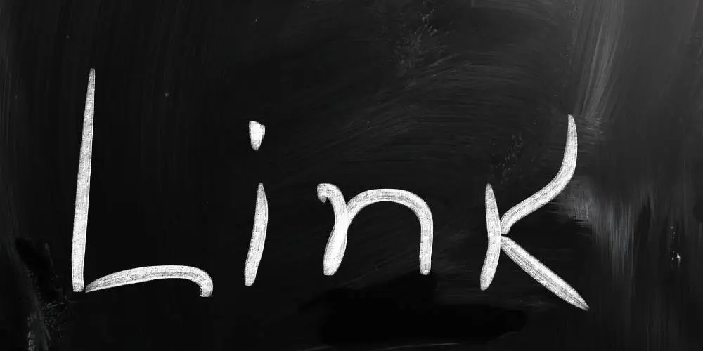 Chalk-style text of the word 'Link' on a black, chalkboard-like background.