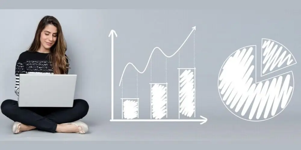 A woman sitting with a laptop next to drawn bar and pie charts, symbolizing growth and analytics in affiliate marketing on social media.