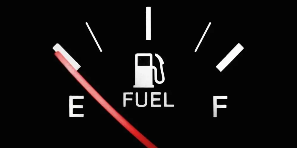 A fuel gauge pointing to empty, symbolizing the importance of proper nutrition to avoid burnout and keep energy levels up for productivity.